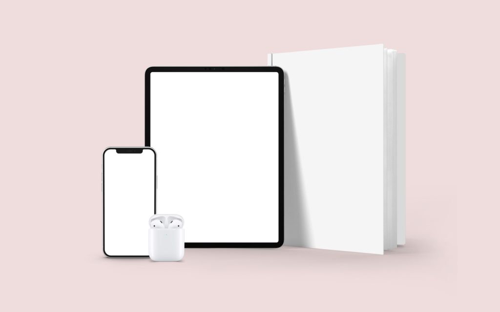 ipad iphone and book stand on a light background