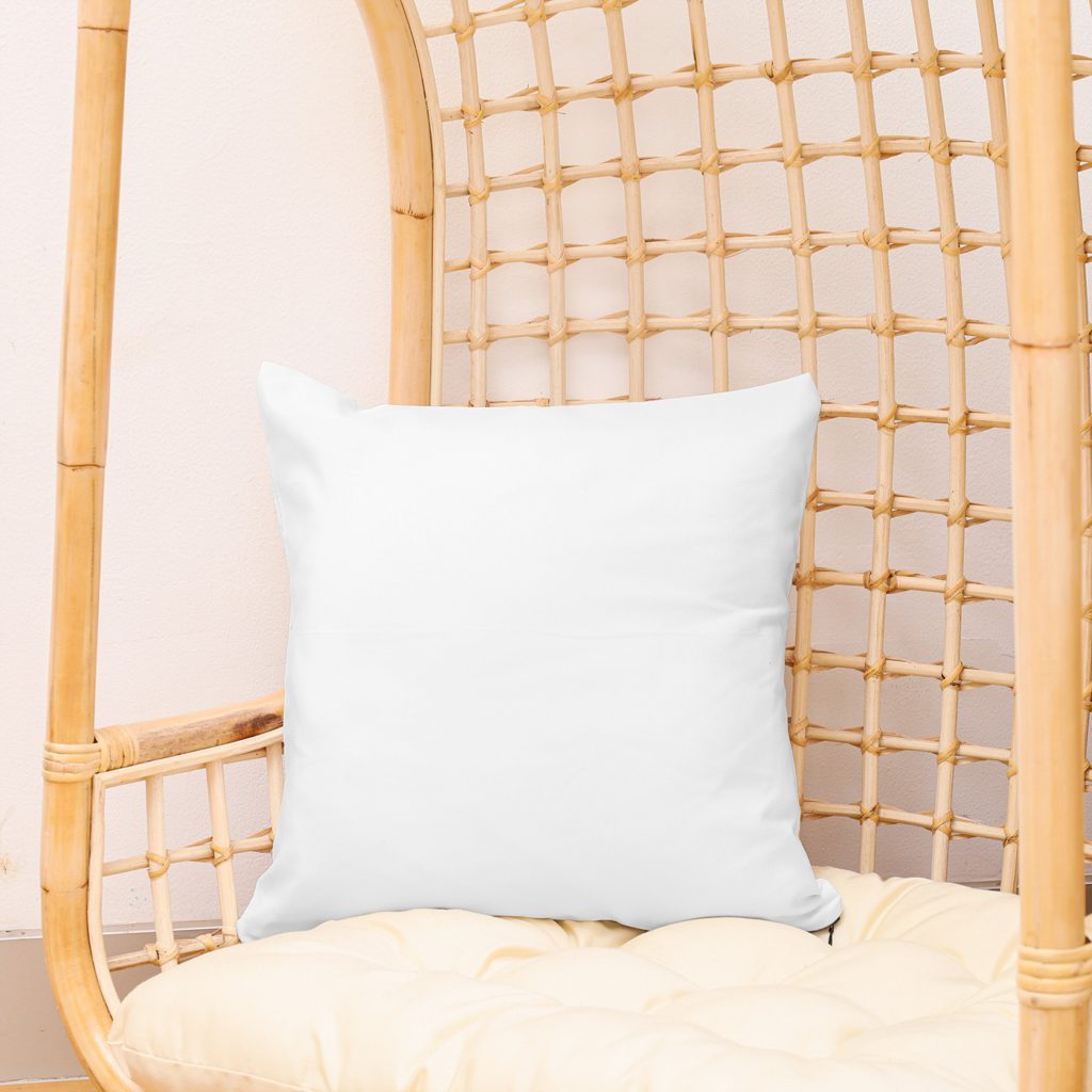 A pillow on a comfortable chair.
